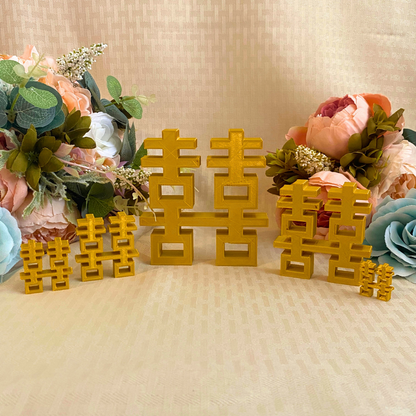 Gold 3D printed double happiness signs in various sizes for wedding reception