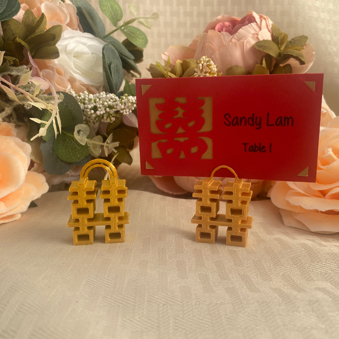 Small gold place card holders with double happiness symbol