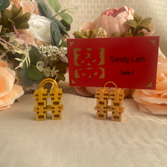 Small gold place card holders with double happiness symbol