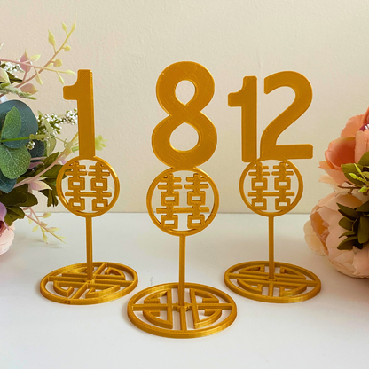 3D printed gold table numbers for Chinese weddings that shows the double happiness symbol