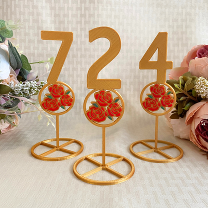 3d printed gold table numbers with red rose design for beauty and the beast wedding theme