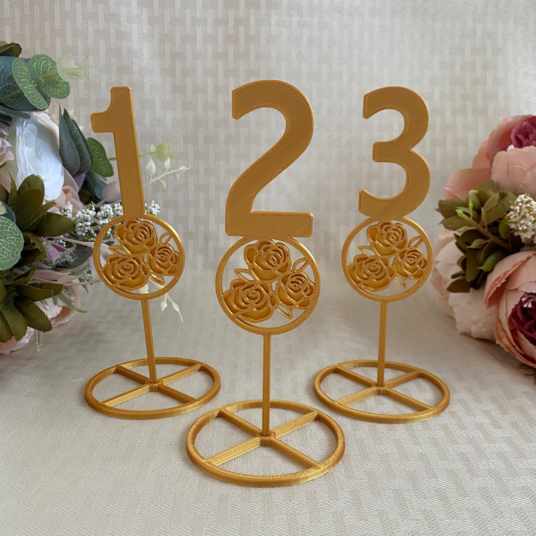 3D printed table numbers with 3 rose design in gold