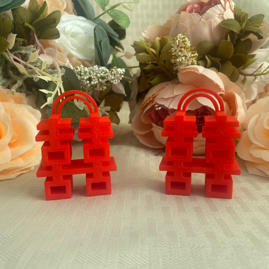 Red table number holders in the shape of double happiness symbol